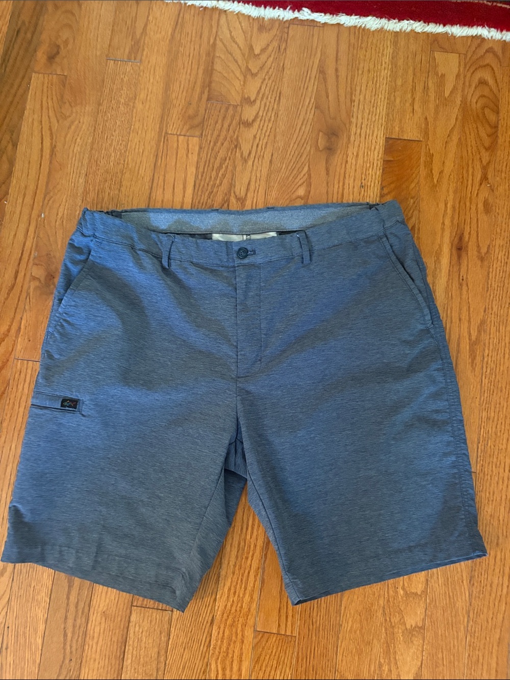 These are Greg Norman men's gray classic stretch golf shorts cargo pocket.